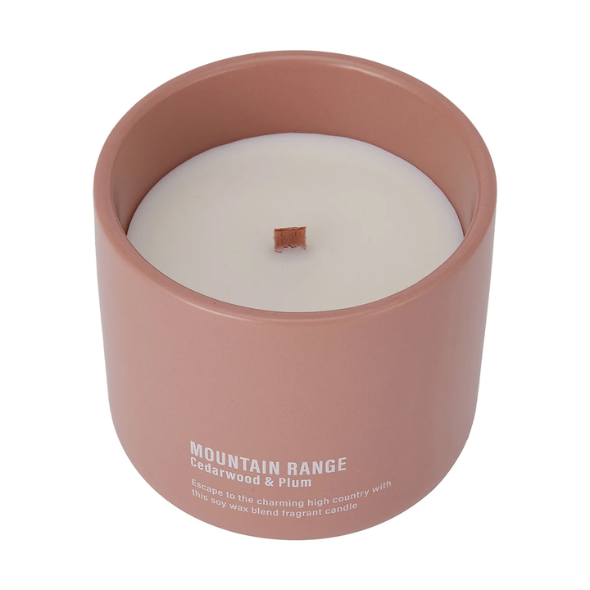 26. kmart Mountain Range Cedarwood and Plum Fragrant Candle $10.00.png